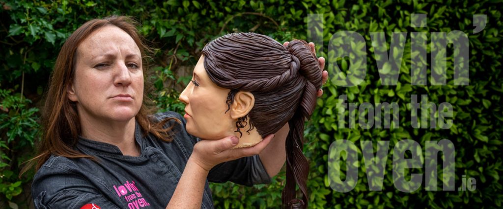 Two women by ivy wall